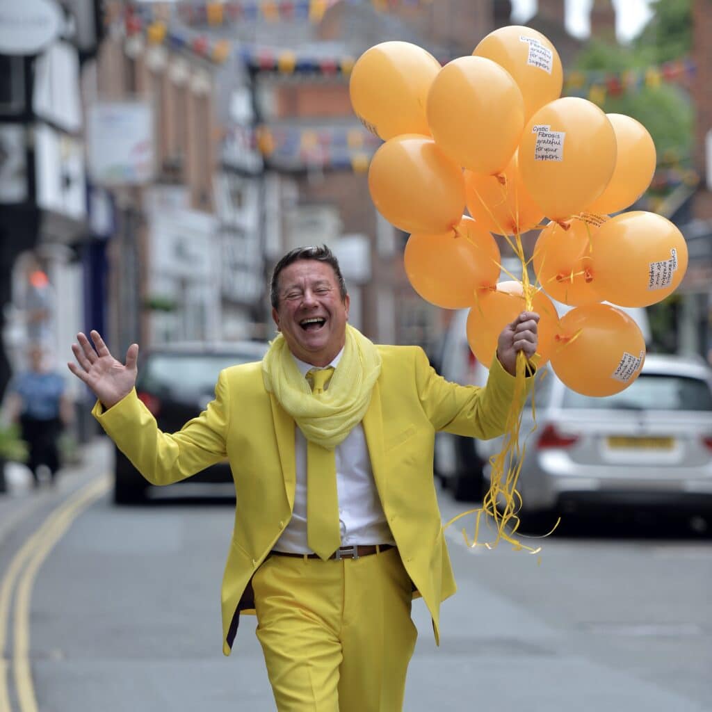 POP Peter with yellow balloons on King Street square image POP Peter with yellow balloons on King Street square image